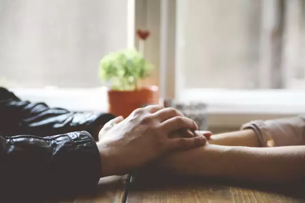 Couple holding hands