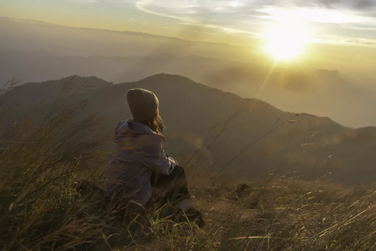 Lifestyle traveler happy feeling good relax and freedom facing in the sunrise morning. Travel Concept