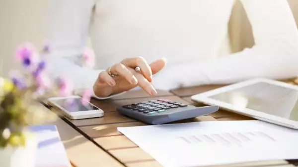 Businesswoman using calculator