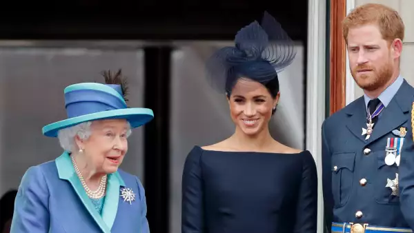 Reina Isabel, príncipe Harry y Meghan Markle