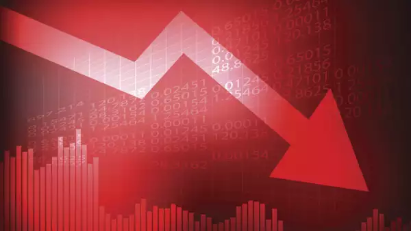 Decreasing graph and arrow on red stock board