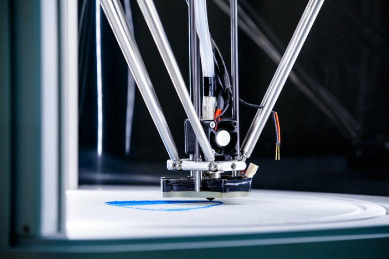 Three dimensional 3D printing machine in action