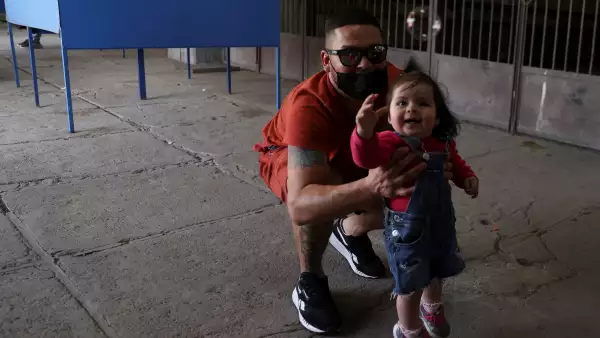 Chileans vote in a mandatory plebiscite to approve or reject the new Constitution