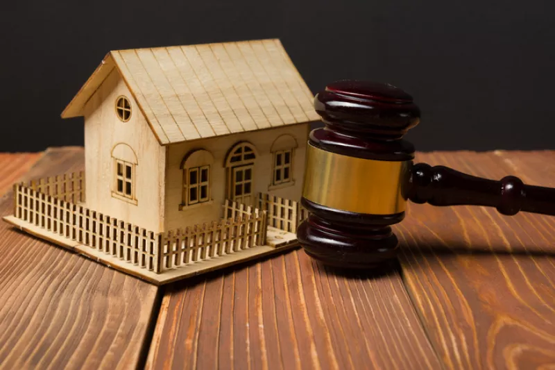 Auction. Law. Miniature House on wooden table and Court Gavel
