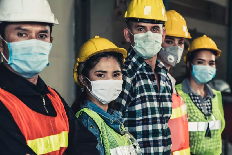 Workers with face mask protect from outbreak of Corona Virus Disease 2019.