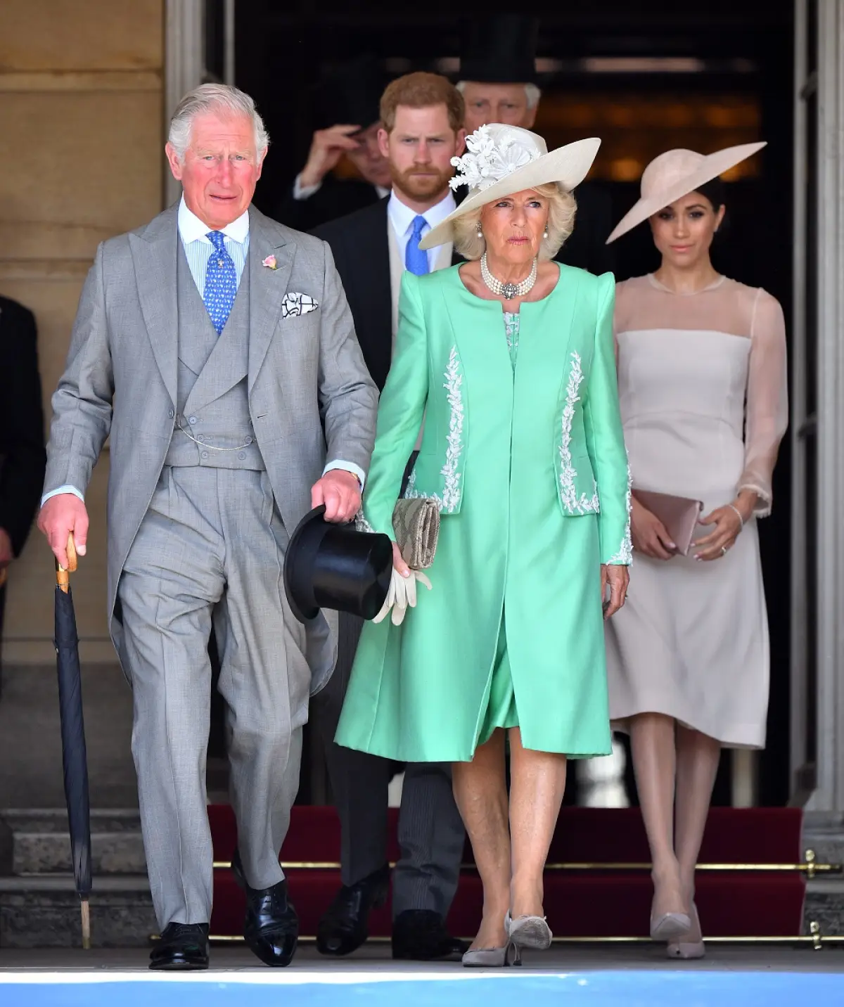 Príncipe Carlos, príncipe Harry, Camila de Cornualles​ y Meghan Markle