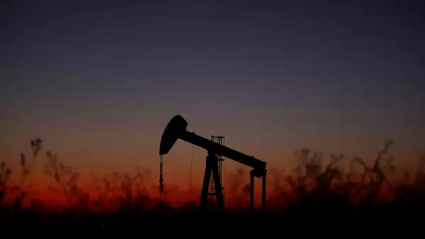 An oil pump is seen just after sunset outside Saint-Fiacre