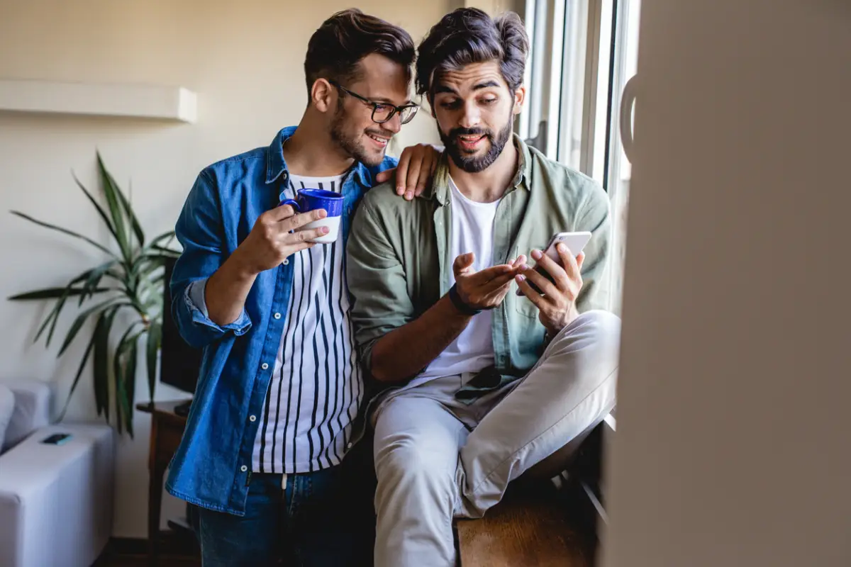 Gay men couple at home