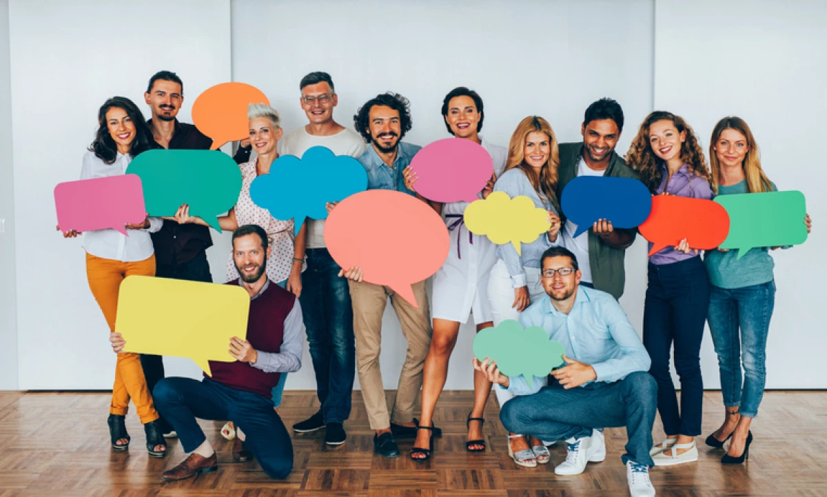 Businesspeople holding speech bubbles