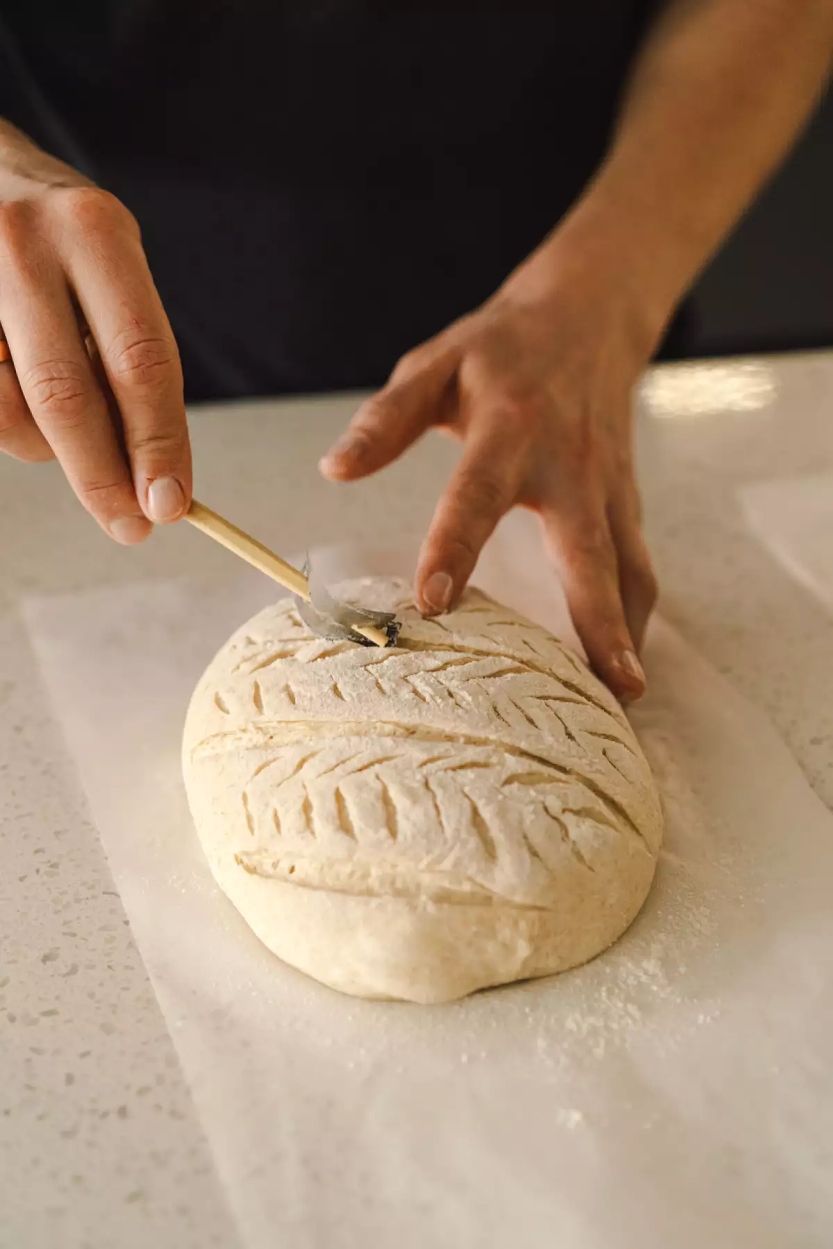 Woman preparing sourdough bread at home