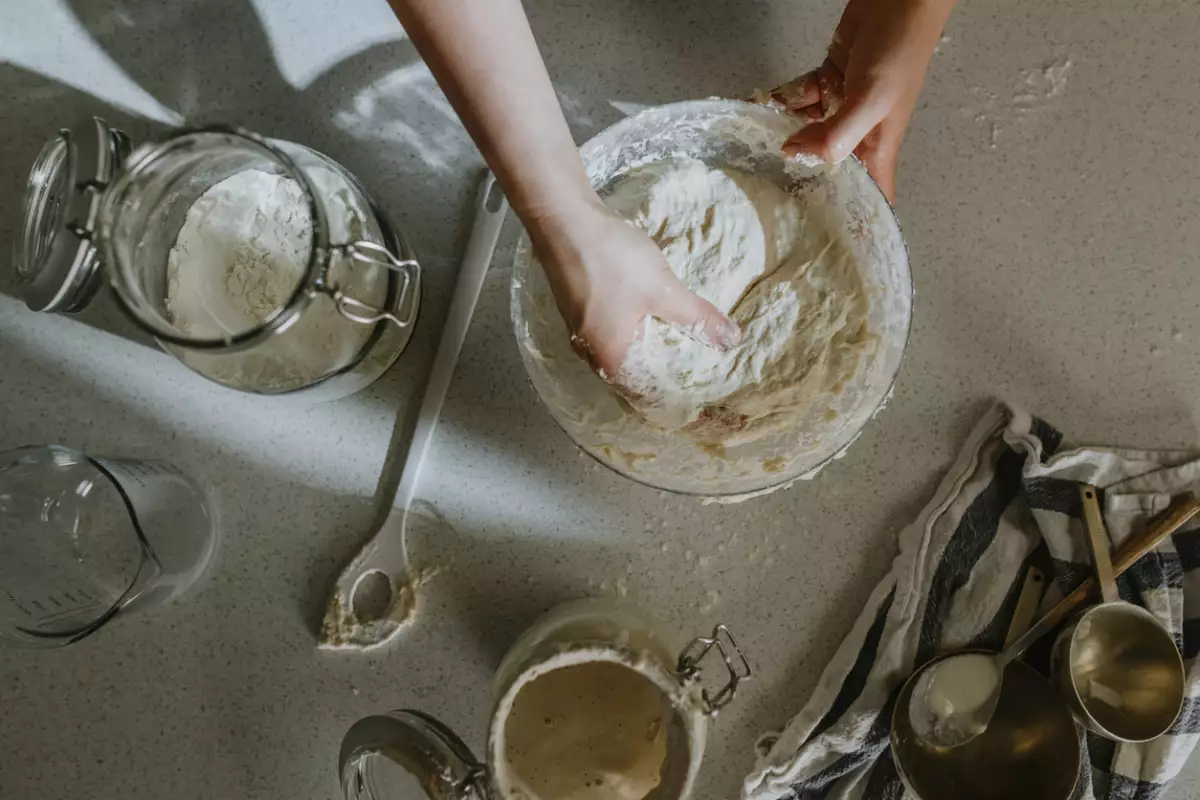 Home Hobbies: Hands of an Anonymous Woman Baking Sourdough Bread from Scratch - the Kneading Phase