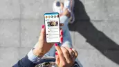 Woman using social media microblogging app on her phone