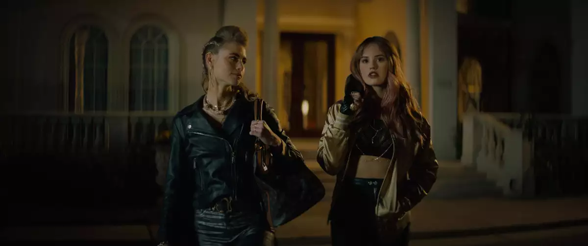 NIGHT TEETH (2021). Lucy Fry as Zoe and Debby Ryan as Blaire.