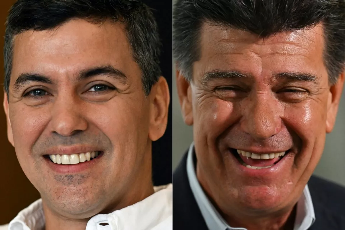 Esta combinación de fotos creadas el 28 de abril de 2023 muestra una foto de archivo tomada el 27 de abril de 2023 del candidato presidencial paraguayo para el Partido de Colorado, Santiago Pea (i.o la derecha), sonriendo durante una entrevista con la AFP en Asunción y una foto de archivo tomada el 25 de abril de 2023 del candidato presidencial paraguayo de la Coalición para un Nuevo Paraguay, Efraín Alegre, hablando durante una entrevista con AFP en Asunción. 