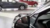New cars at dealer showroom. Themed blur background with bokeh effect. Car auto dealership.