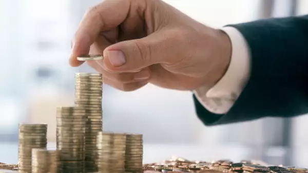 Businessman is stacking coins