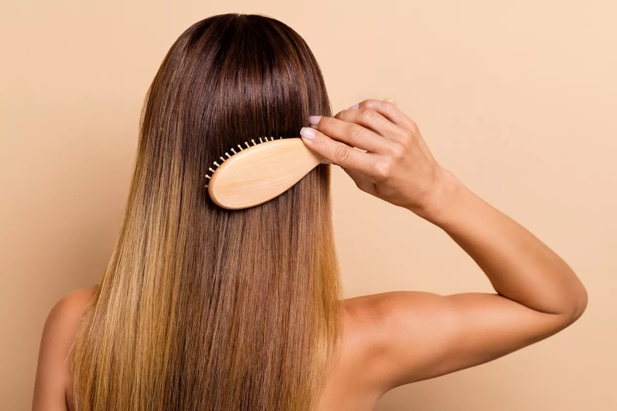 Rear,Back,Behind,View,Portrait,Of,Attractive,Woman,Combing,Smooth