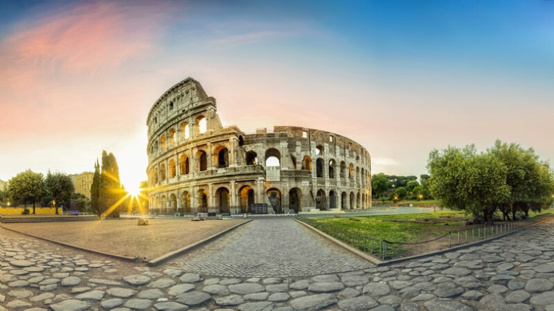 Colosseum in Rome and morning sun, Italy