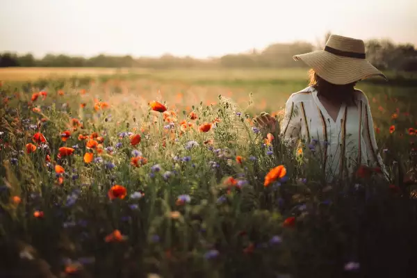 Stylish,Woman,In,Rustic,Dress,And,Hat,Walking,In,Summer