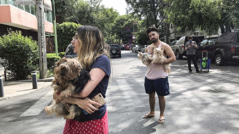 People react after an earthquake in Mexico City