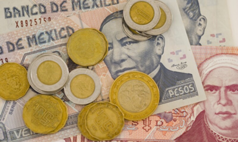 Analistas prevén que el peso alcance las 15 unidades por dólar en 2015. (Foto: Getty Images )