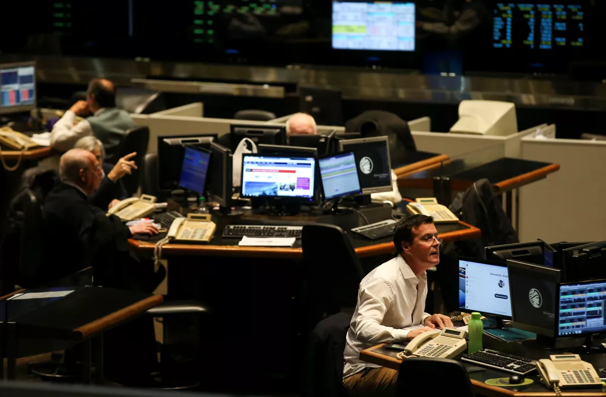 Traders work on the floor of the Buenos Aires Stock Exchange