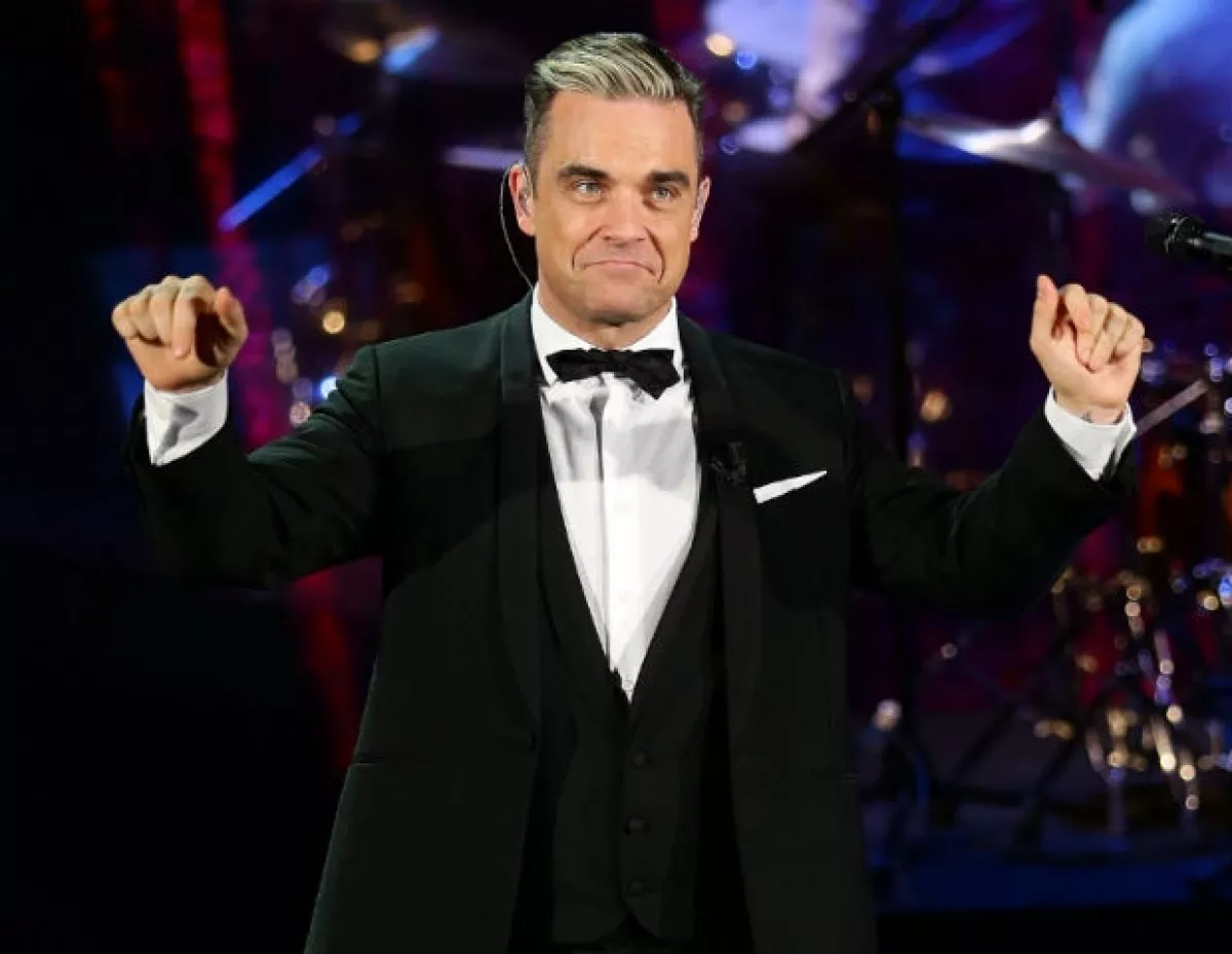 El matrimonio y la paternidad han hecho de Robbie una nueva persona.