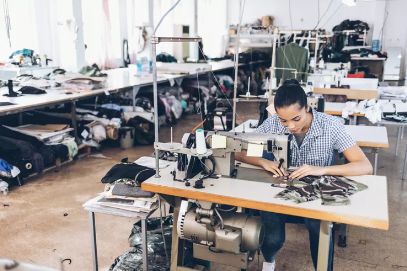 Tailor and worker in Chinese clothes factory