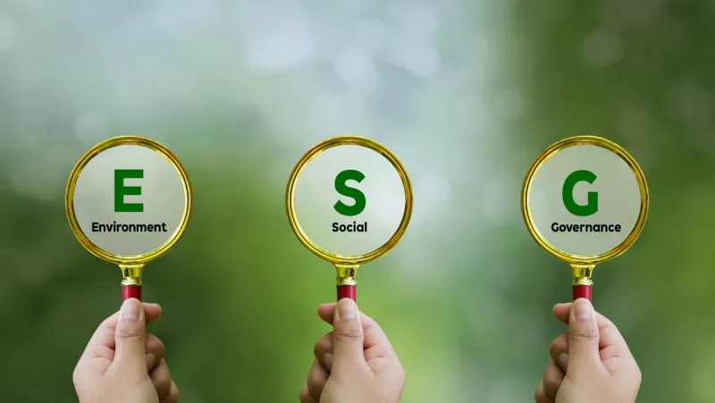 Words ESG. on magnifier glass with green backgroud. Concept of environmental, social and governance. Sustainable and ethical business. account the environment, society and corporate governance.
