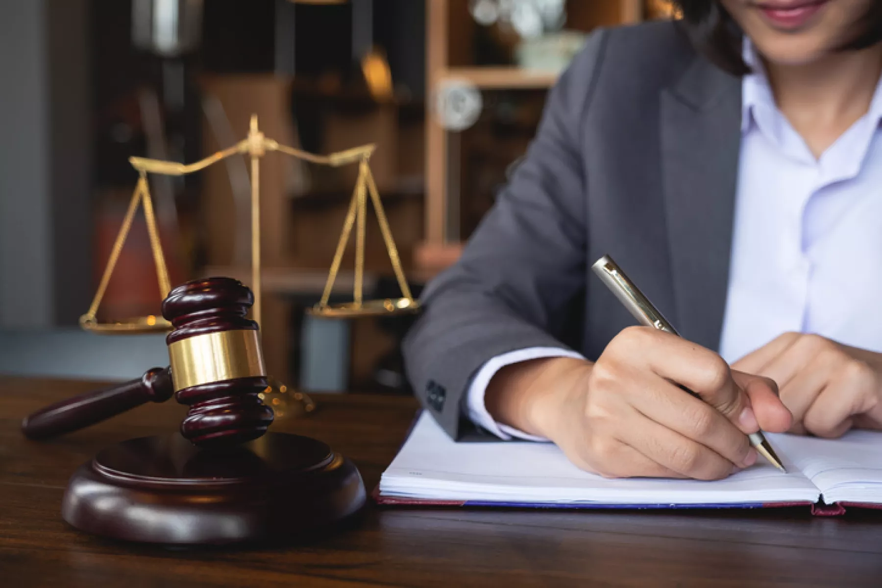 Judge gavel with Justice lawyers, Business woman in suit or lawyer working on a documents. Legal law, advice and justice concept.