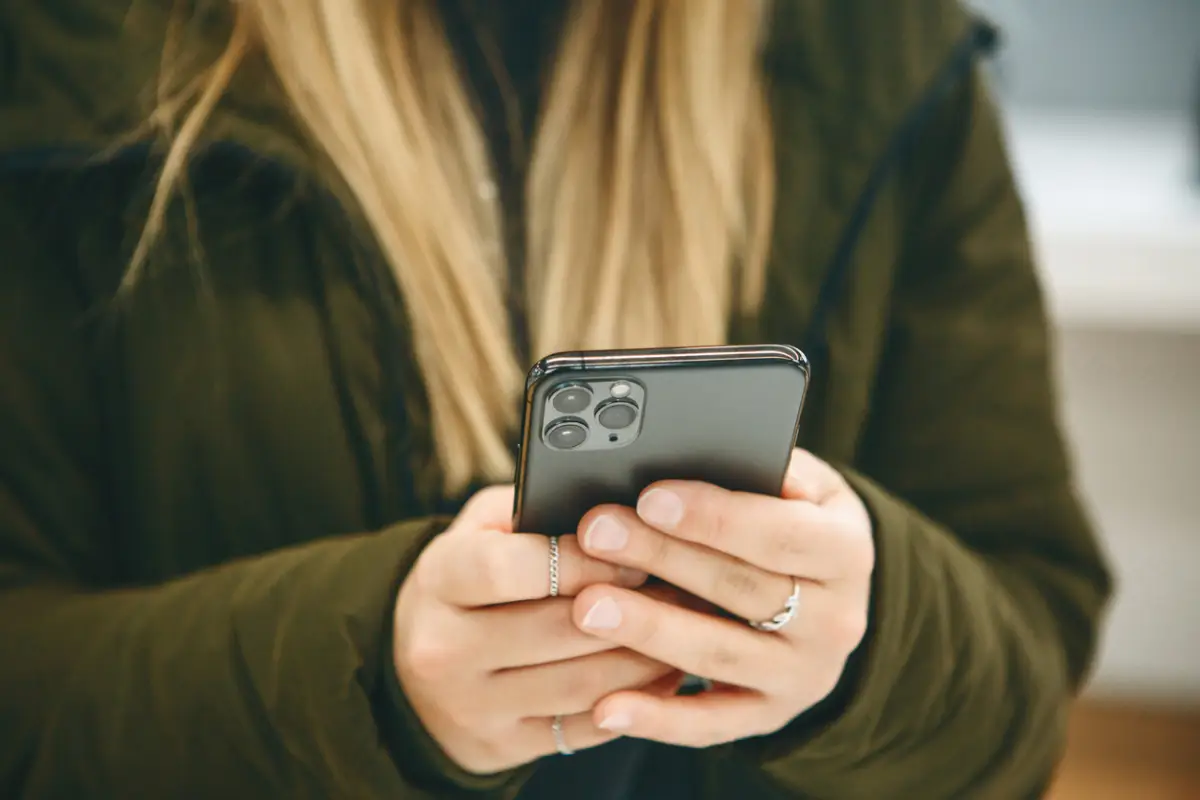 The girl uses a new cell phone