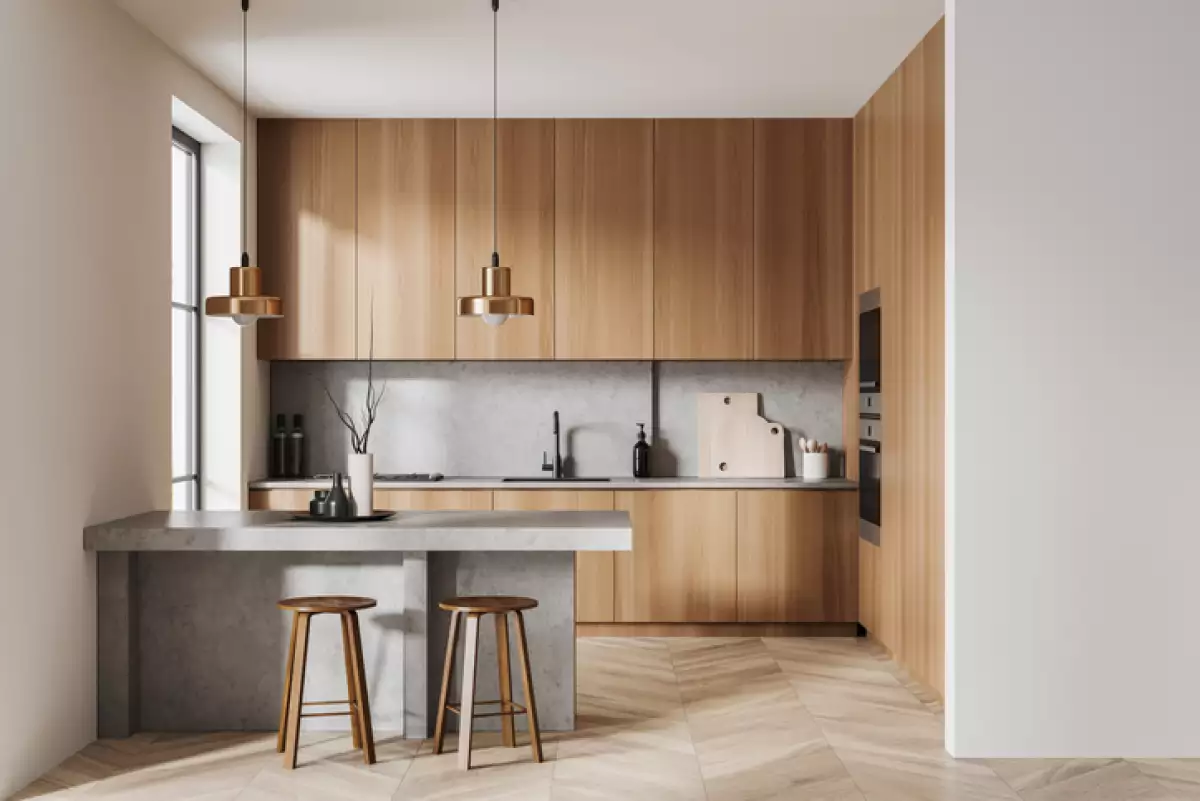 Light kitchen interior with bar countertop and seats, cooking zone