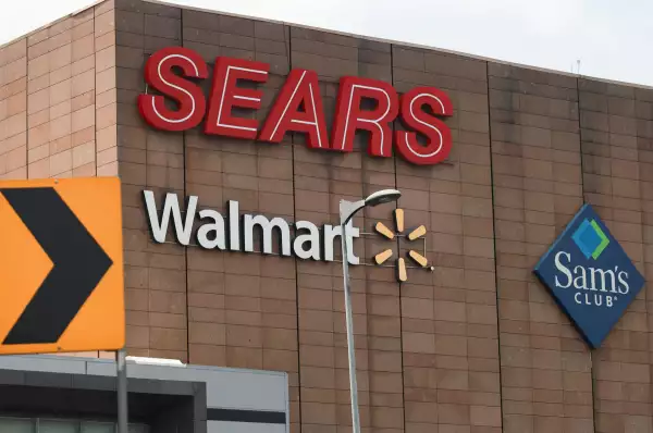 The logos of Sears, Walmart and Sam's Club are seen on the facade of the stores' building in Mexico City