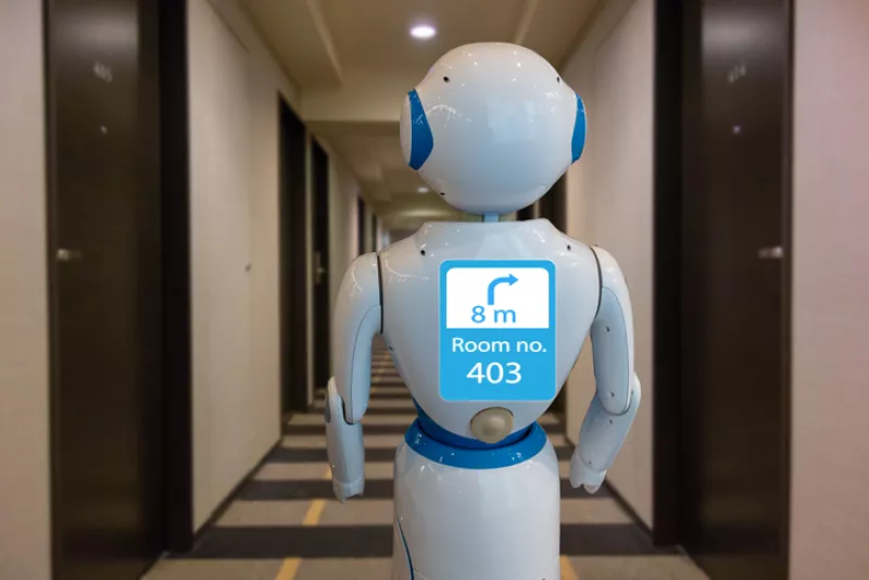 smart hotel in hospitality industry 4.0 technology concept, robot butler (robot assistant) use for greet arriving guests, deliver customer, items to rooms, give information, support  variety languages