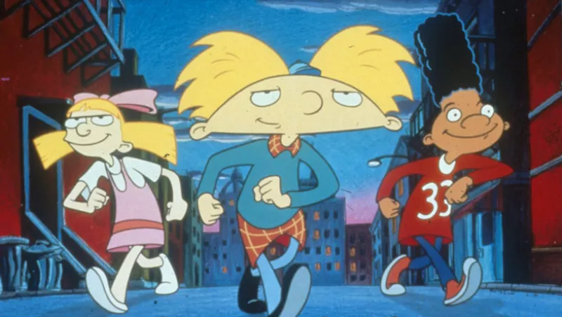 Foto de la caricatura Hey, Arnold! de Nickelodeon donde se ve a Arnold cabeza de balón, Helga Pattacky y Gerald Johanssen.