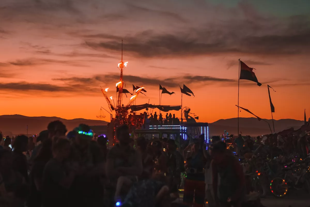 People,Dancing,At,The,Sunset,Enjoying,The,Music,Festival,And