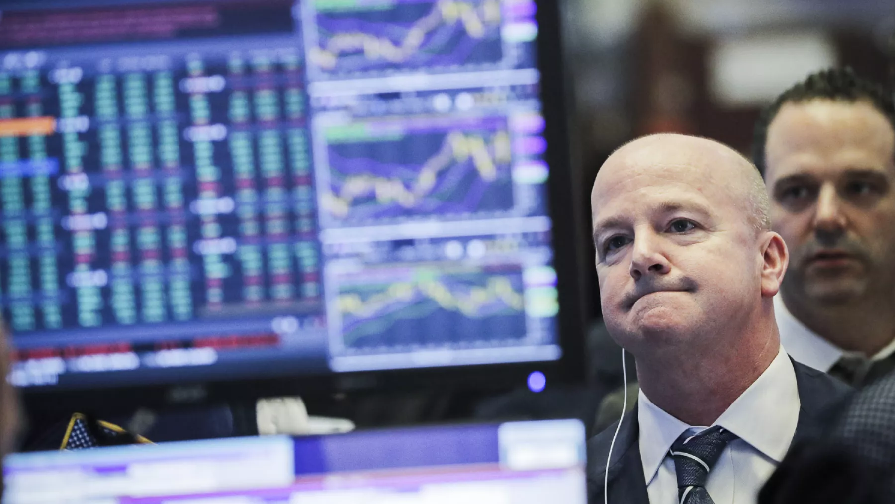 Traders work on the floor of the New York Stock Exchange shortly after the opening bell in New York