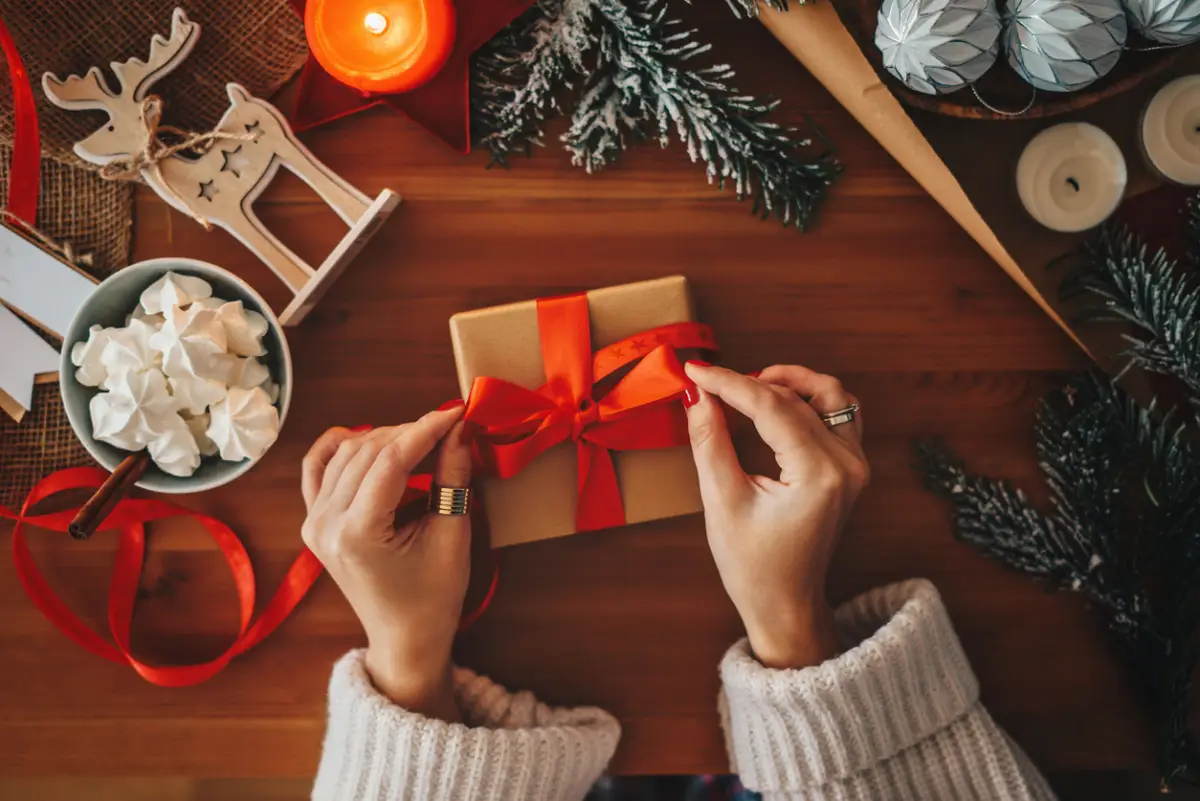 Woman wrapping Christmas gifts