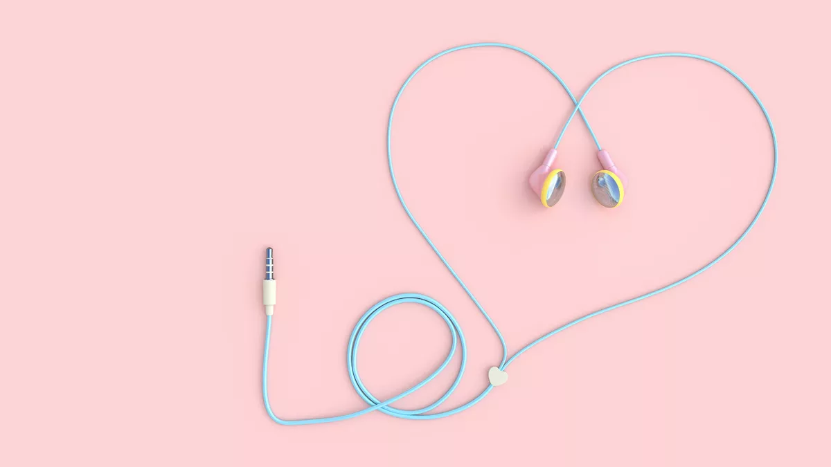 earphones pink color heart shape on pastel pink background
