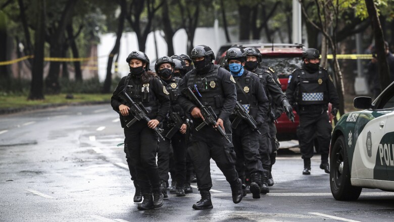 Police officers arrive at the area where a shooting took place in Mexico City