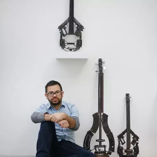 Mexican Artist Pedro Reyes Rehearses Using Musical Instruments He Has Created From Weapons Confiscated From Mexican Cartels