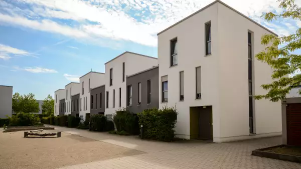 Modern townhouses in a residential area, new apartment buildings with green outdoor facilities in the city