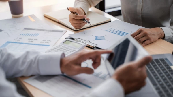 Business sales consultant discussing in data documents at modern office.