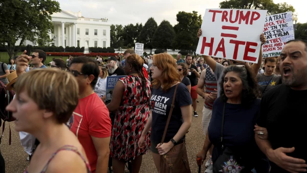People gather for a vigil in response to the death of a counter-demonstrator