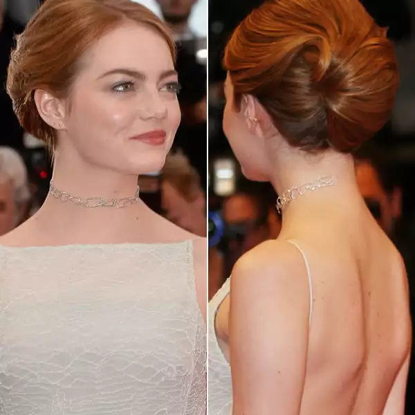 Emma Stone llevó un chongo que parecía una ola de mar, haciendo lucir su color de pelo. Sus labios iban en un tono naranja mate, resaltando sus ojos y el color del vestido.
