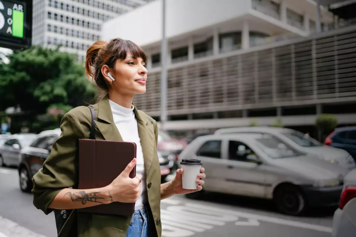 Business woman with tablet and coffee at Paulista Avenue in Sao Paulo , Brazil