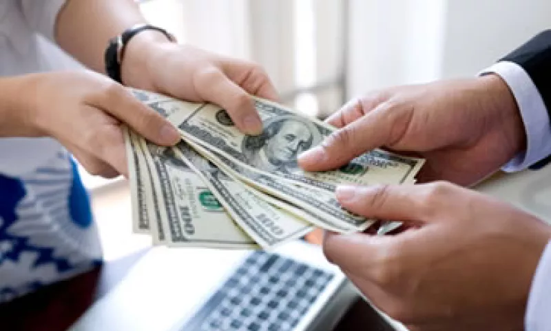 Banco Base estimó que el tipo de cambio oscile entre 12.91 y 12.98 pesos por dólar. (Foto: Getty Images)