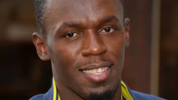 Usain Bolt Signs Copies Of His Autobiography "Faster Than Lightning: My Autobiography" At PUMA Store