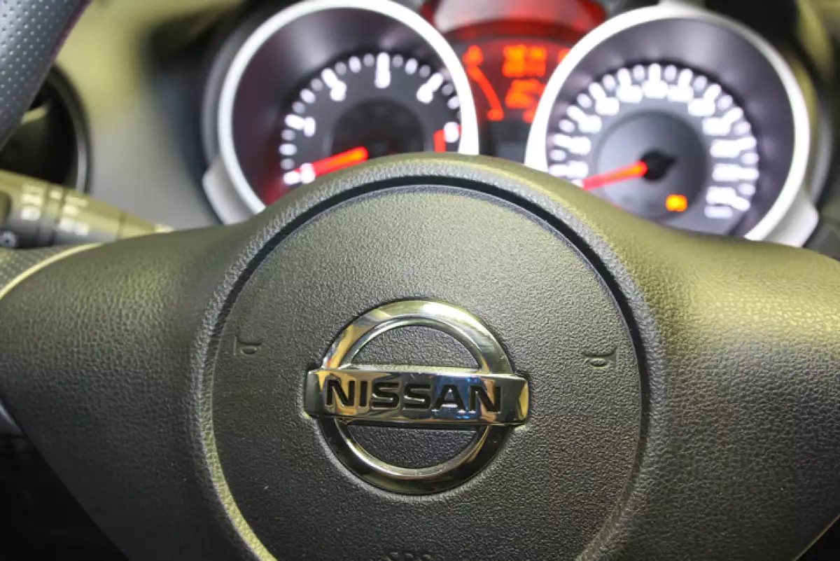 Nissan logo on a car steering wheel