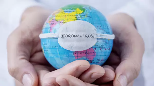 globe with a mask and text coronavirus